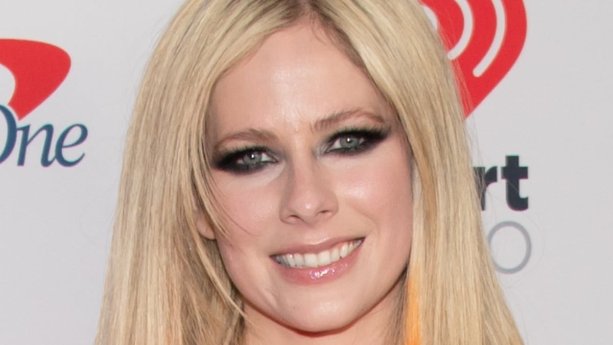 Avril Lavigne smiles into the camera.