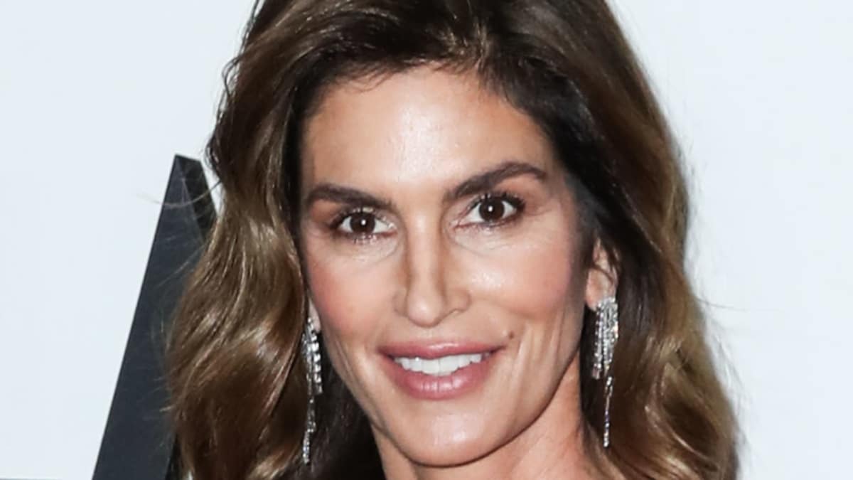 Cindy Crawford smiles into the camera.