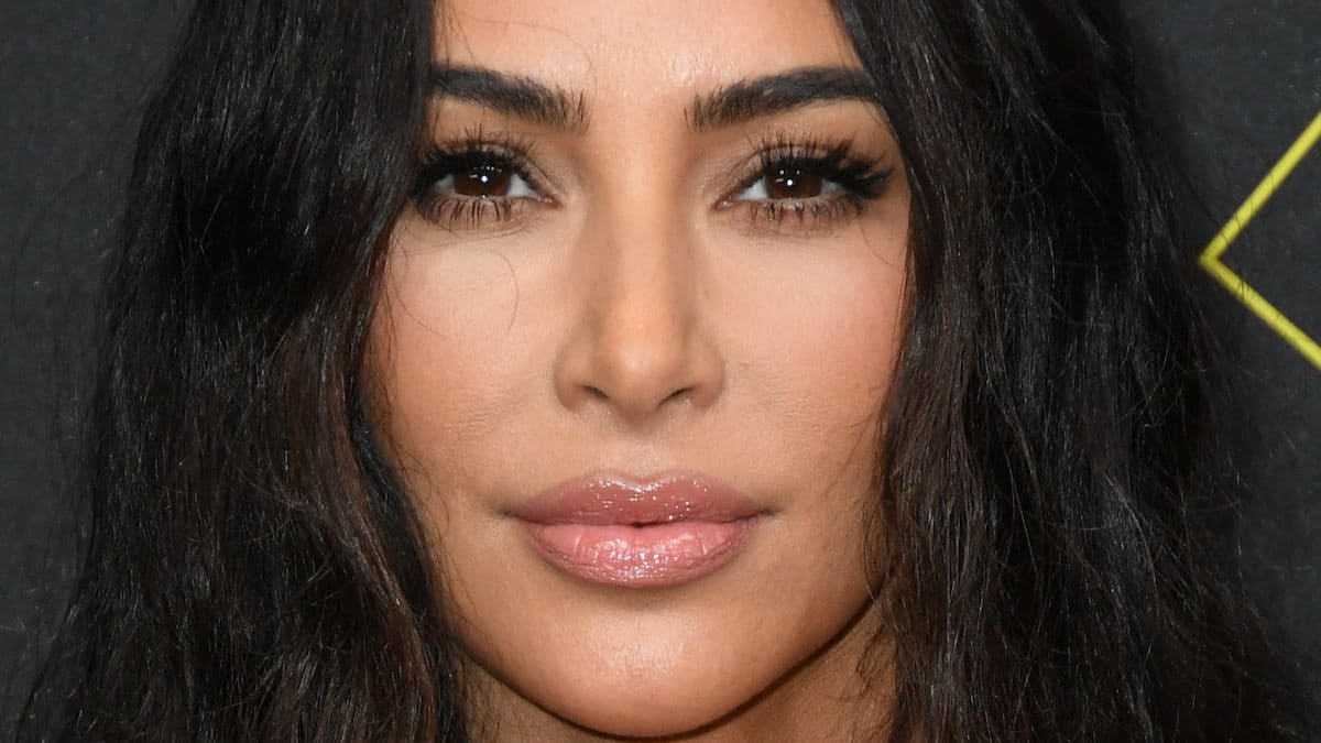 Kim Kardashian gazes into the camera.