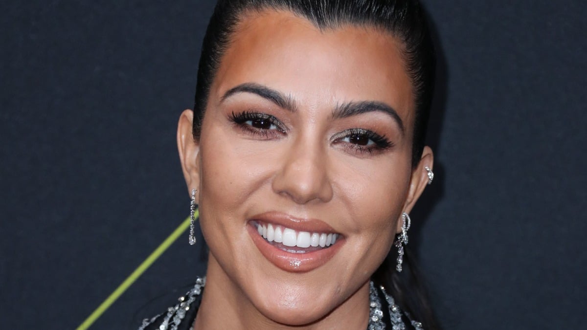 Kourtney Kardashian smiles on the red carpet.