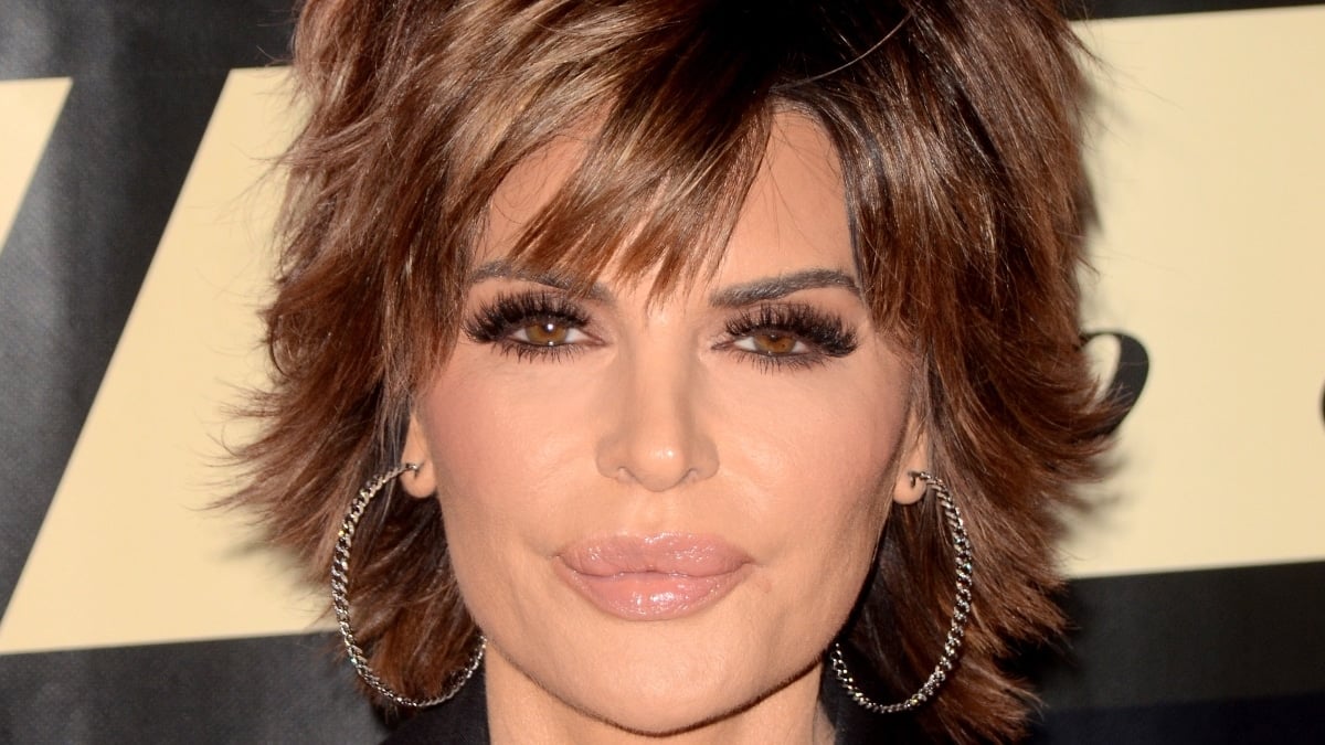 Lisa Rinna poses at an event premiere in large hoop earrings.