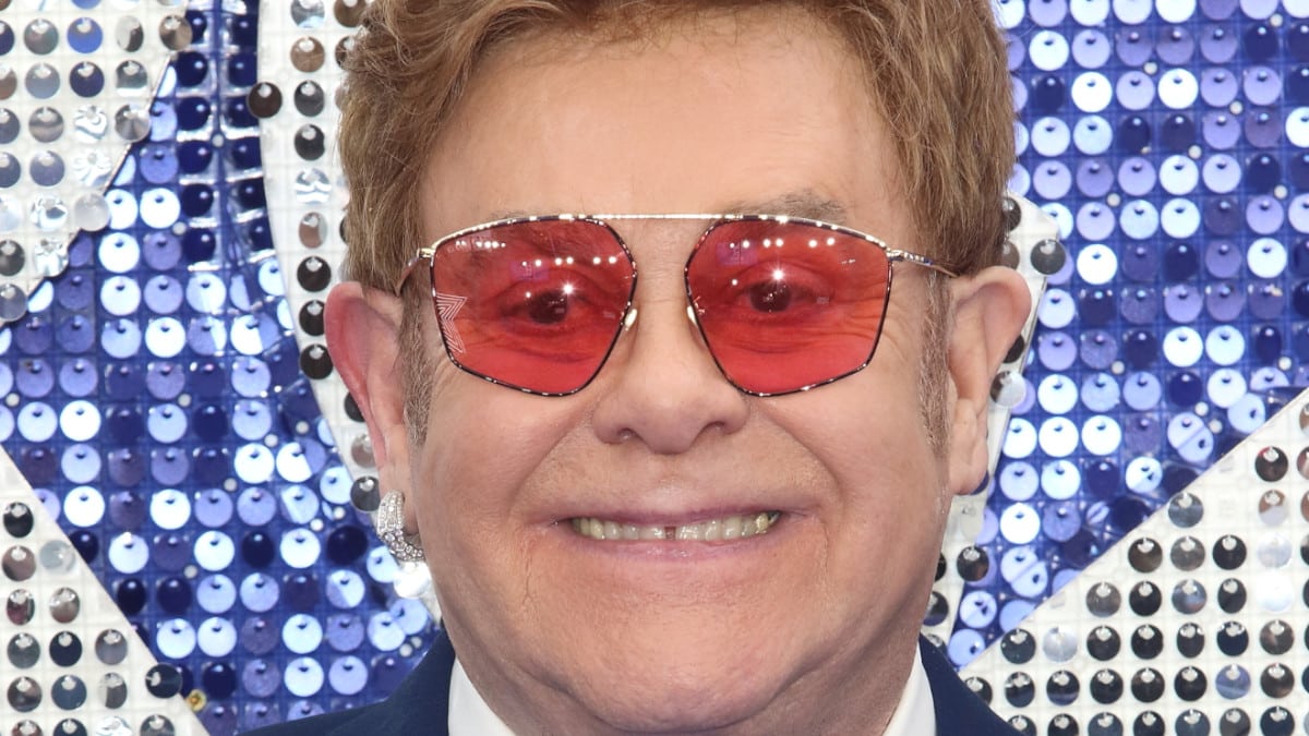 Elton John poses at the premiere of Rocketman