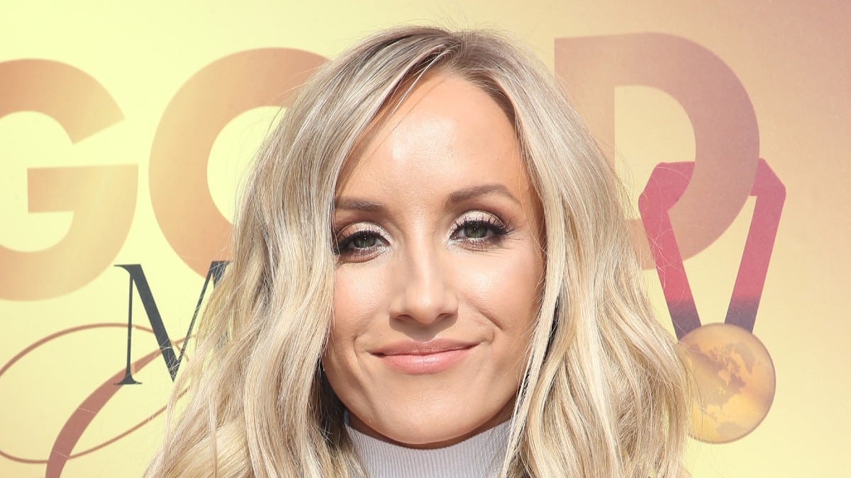 Gymnast Nastia Liukin exhibits off her feathers in plunging inexperienced gown