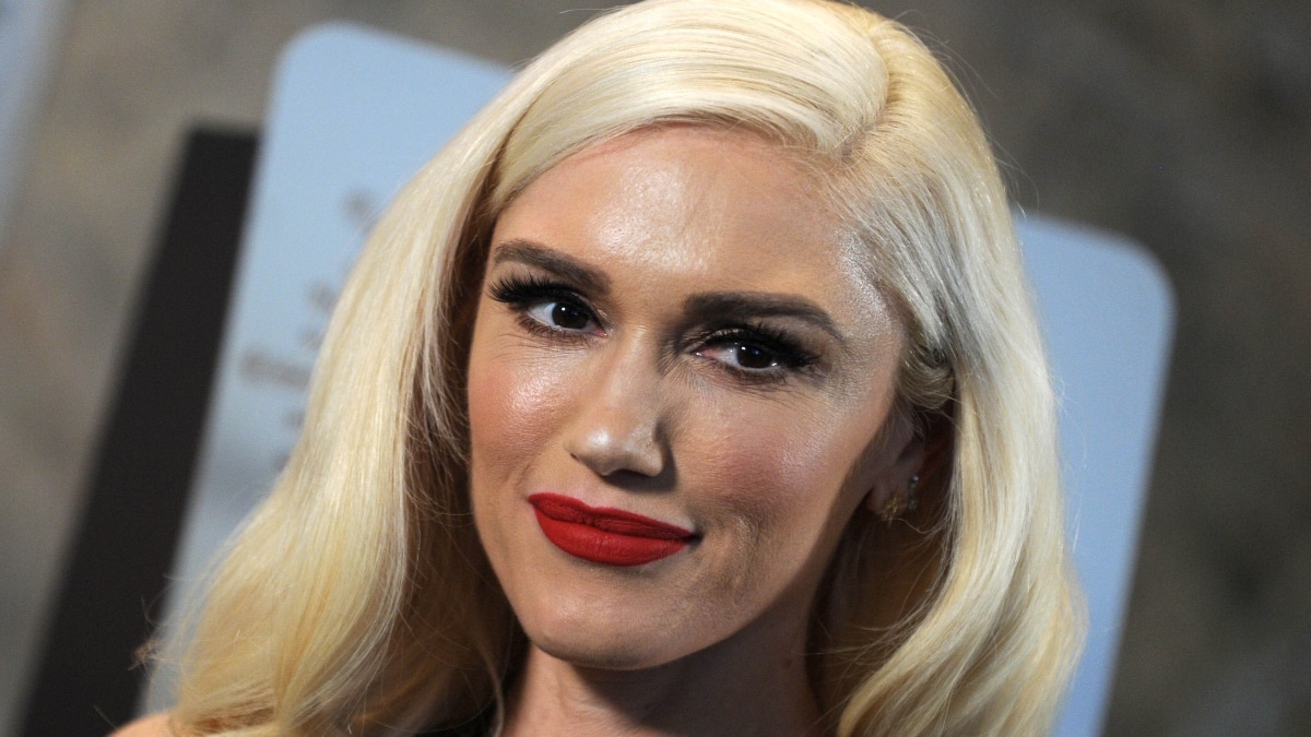 A close-up photo of singer Gwen Stefani grinning for the camera.