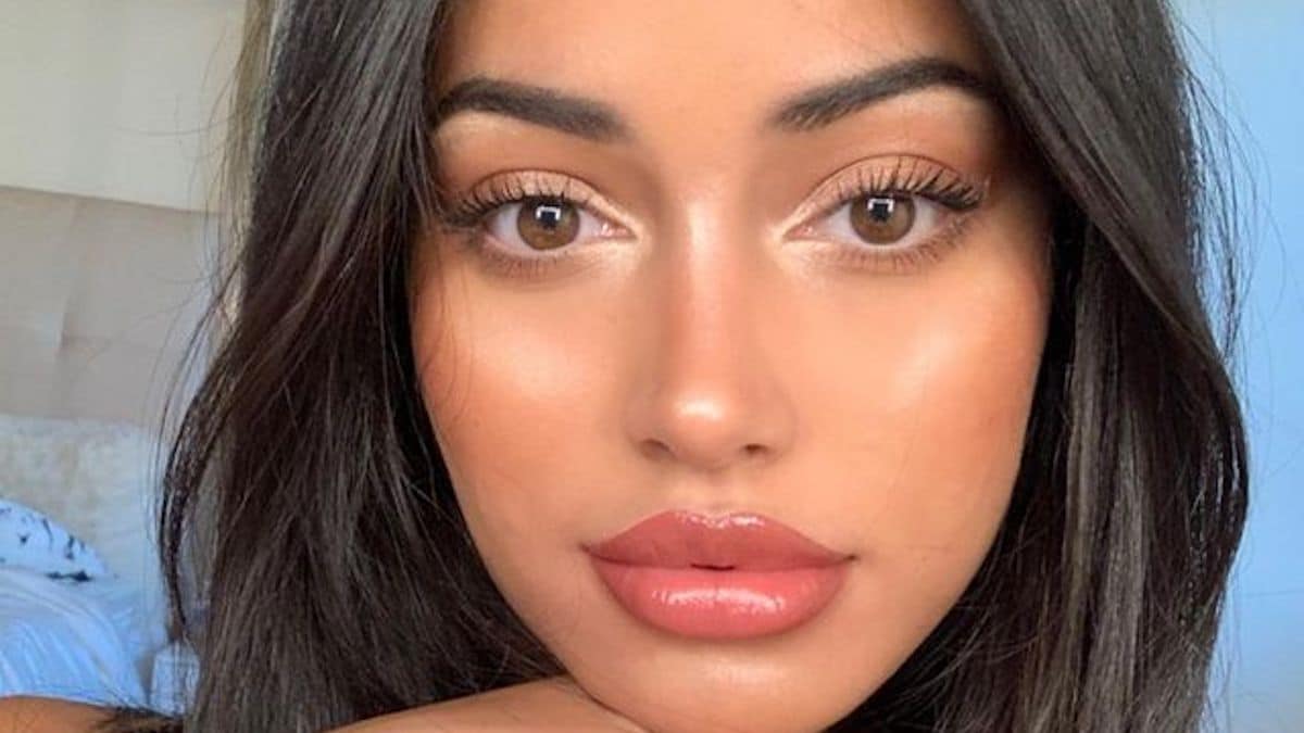 Cindy Kimberly strikes a pose in an impressively stocked closet