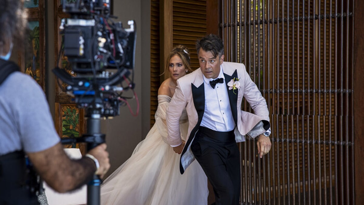 Jennifer Lopez as Darcy Rivera and Josh Duhamel as Tom Fowler in the PrimeVideo movie, Shotgun Wedding.