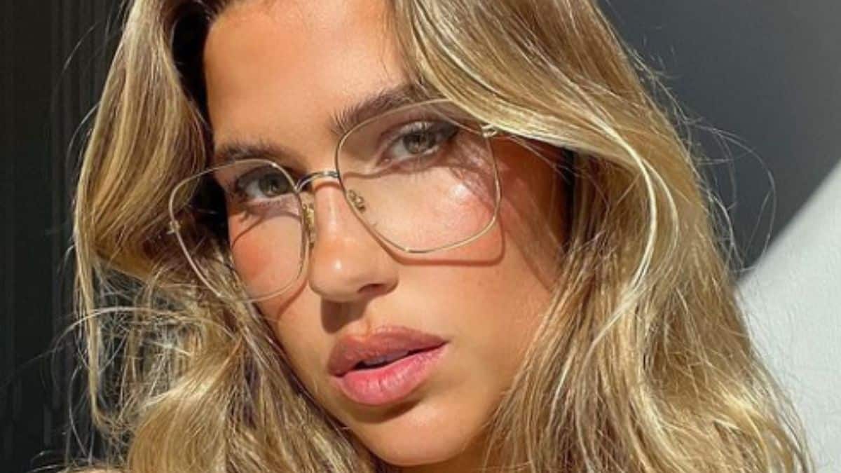 Kara Del Toro in outsized sweater for cozy chair promotion
