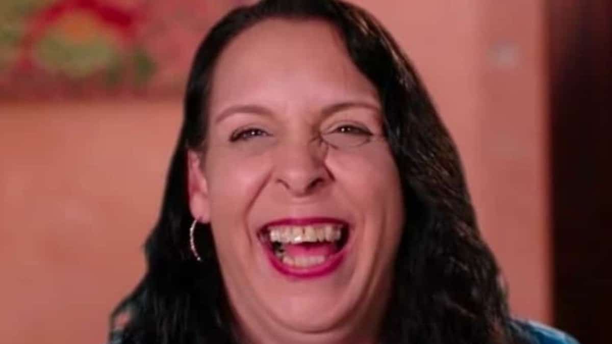 A close-up screen grab of 90 Day Fiance star Kim Menzies laughing.