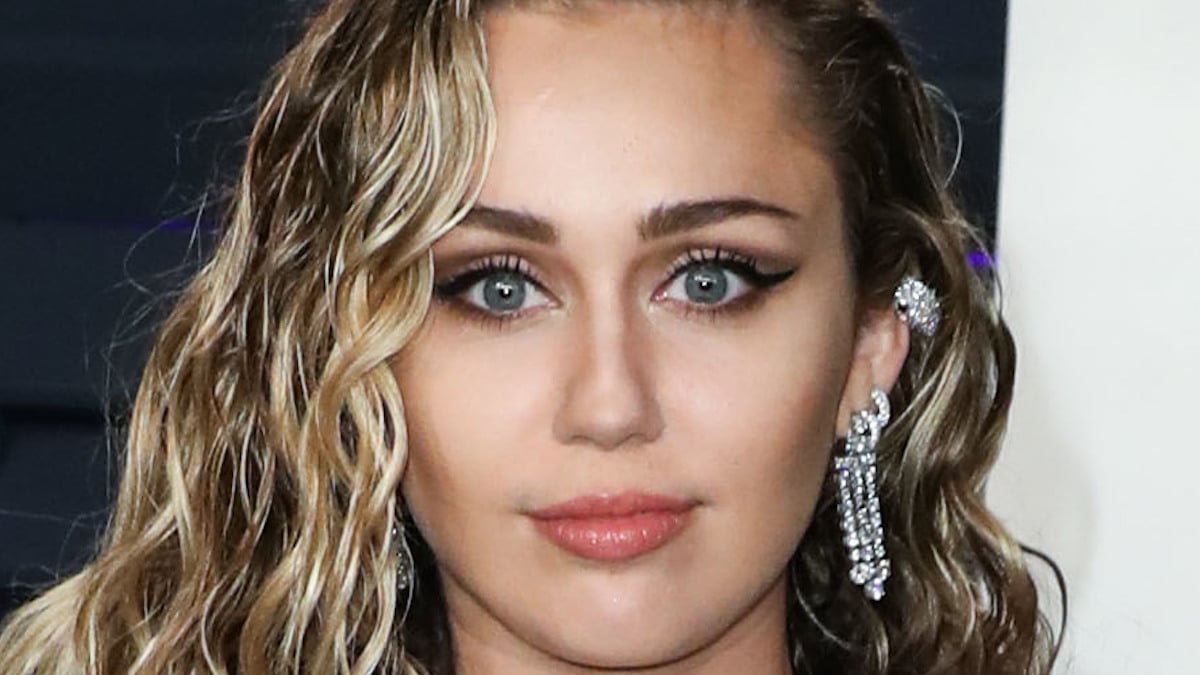 Miley Cyrus in cheeky white one-piece celebrates Flowers success