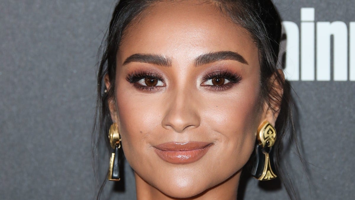 Shay Mitchell twirls in sparkly silver minidress that she loves