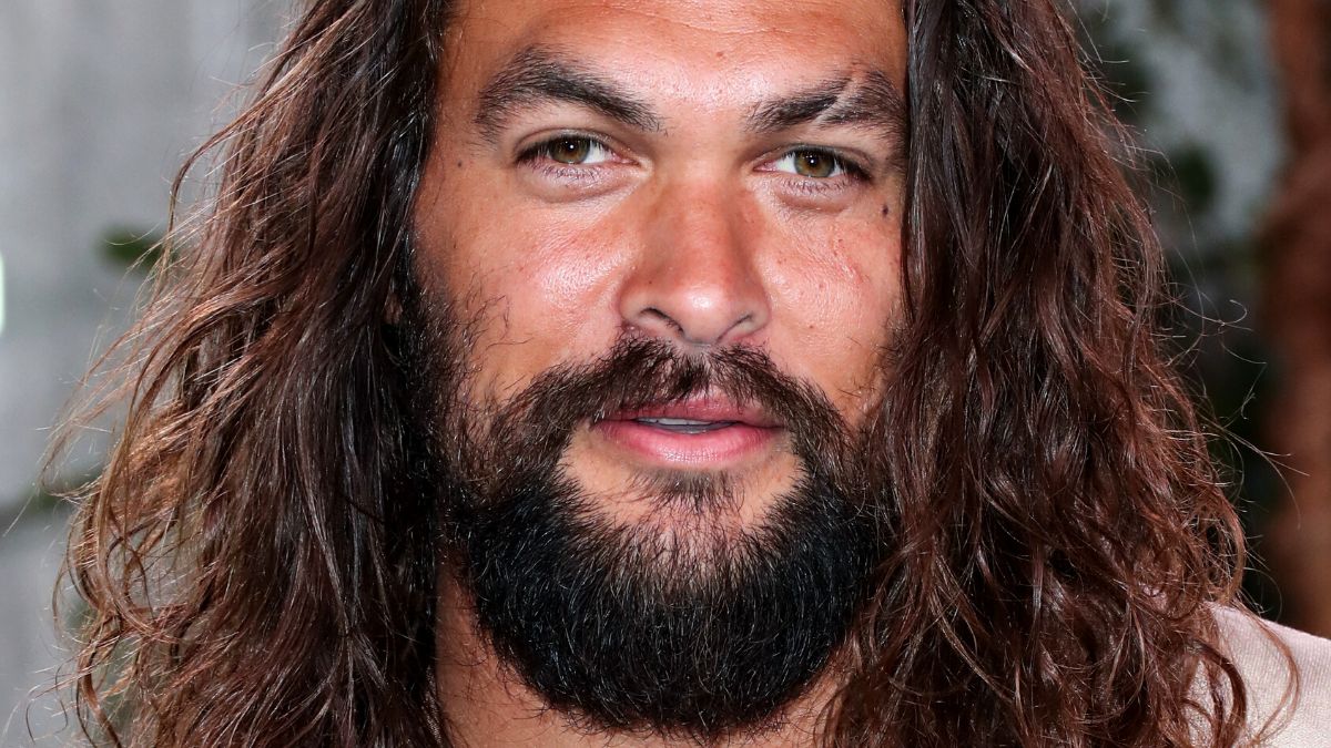Jason Momoa poses for photographers at the Fox Village Theater