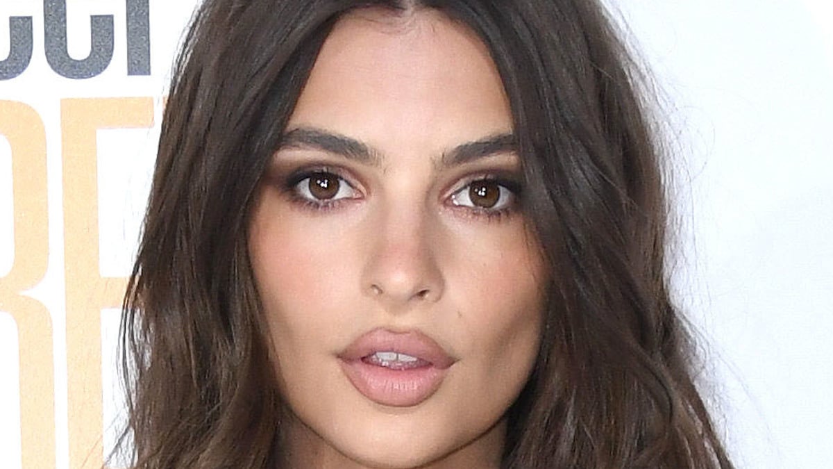 Emily Ratajkowski goes braless and sheer for cleavage reveal