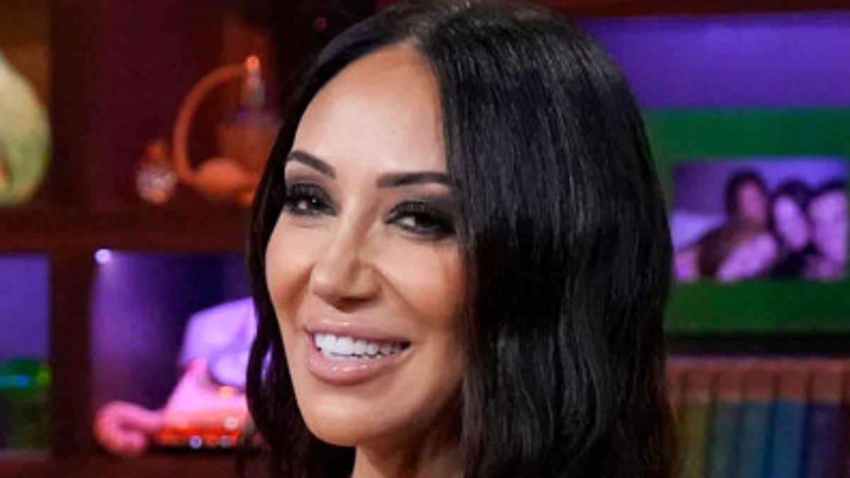 Melissa Gorga is rocker-chic as she sips purple wine in leather-based outfit