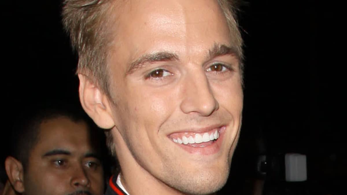Aaron Carter smiling at a public event.