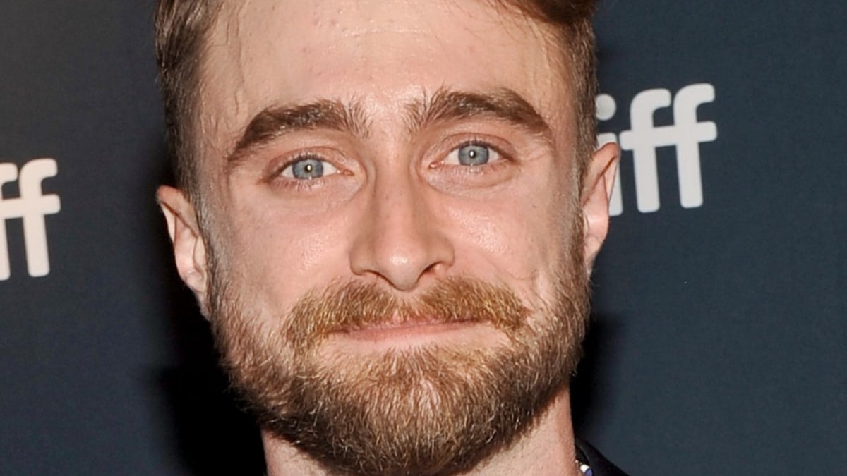 Daniel Radcliffe smiling at the Toronto International Film Festival.