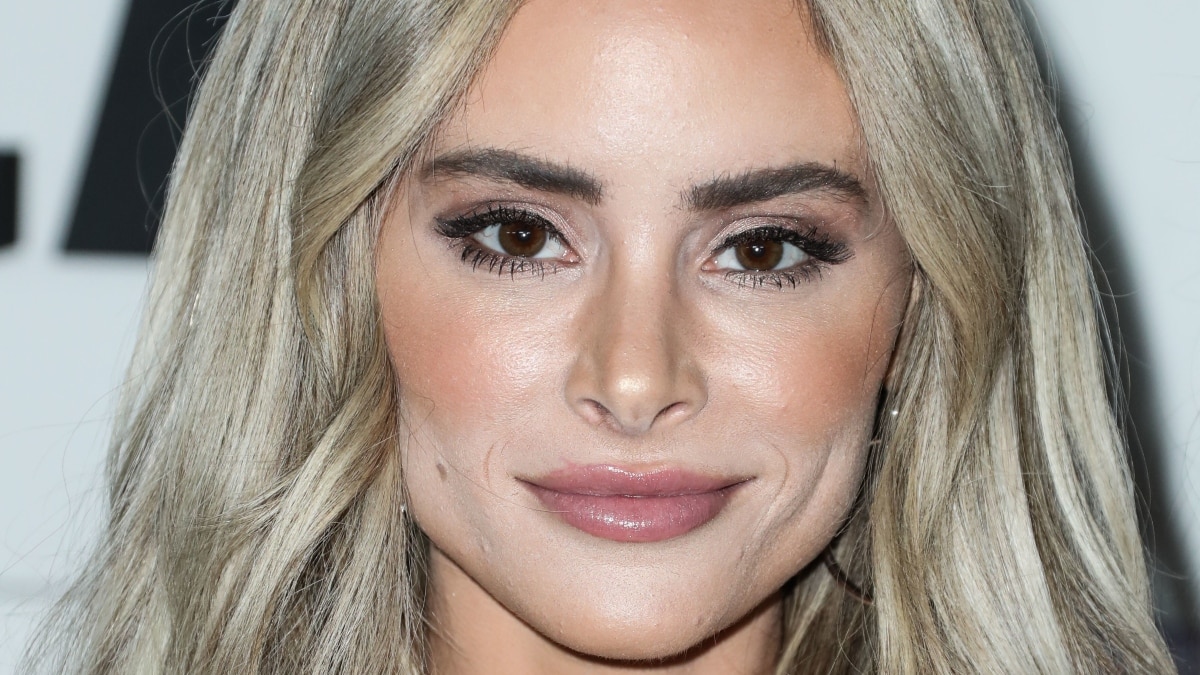 Amanda Stanton stuns poolside in a strapless bikini to tease ‘one thing’ is coming