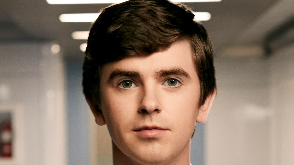 Freddie Highmore poses in a promotional photo for The Good Doctor.