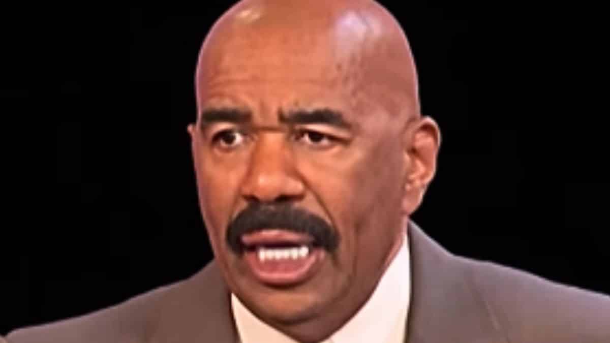 steve harvey on stage during an episode of family feud